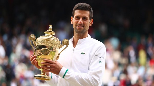 LONDON, ENGLAND - JULY 11: Novak Djokovic of Serbia celebrates with the trophy after winning his mens Singles Final match against Matteo Berrettini of Italy on Day Thirteen of The Championships - Wimbledon 2021 at All England Lawn Tennis and Croquet Club on July 11, 2021 in London, England. (Photo by Julian Finney/Getty Images)
