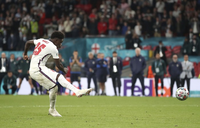 England's Bukayo Saka has his shot saved in the penalty shoot-out during the Euro 2020 soccer championship final match between England and Italy at Wembley Stadium in London, Sunday, July 11, 2021. (Nick Potts/PA via AP)