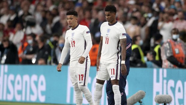 England's Jadon Sancho and Marcus Rashford, right, get ready to enter the pitch during the Euro 2020 soccer championship final match between England and Italy at Wembley stadium in London, Sunday, July 11, 2021. (Carl Recine/Pool Photo via AP)