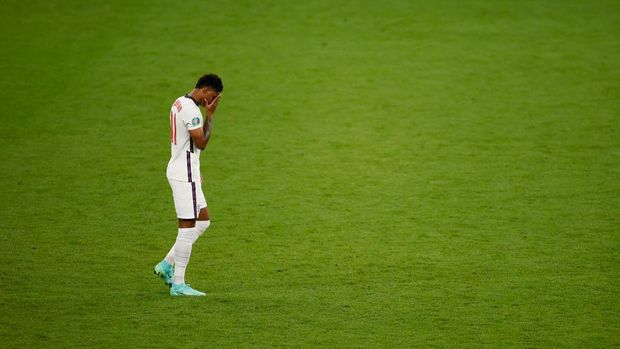 LONDON, ENGLAND - JULY 11: Marcus Rashford of England reacts after missing their team's third penalty in the penalty shoot out during the UEFA Euro 2020 Championship Final between Italy and England at Wembley Stadium on July 11, 2021 in London, England. (Photo by John Sibley - Pool/Getty Images)