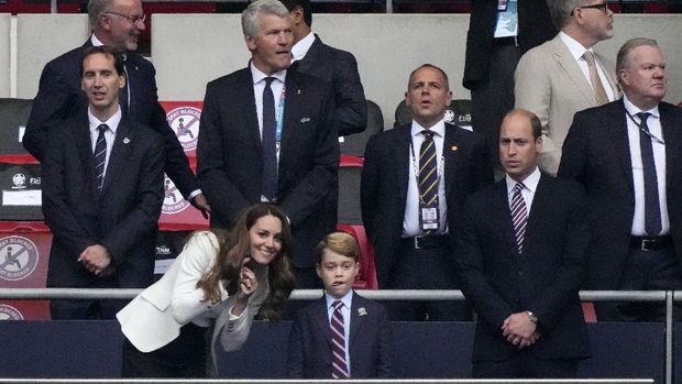 Prince William, his son Prince George and Duchess Catherine, from right, stand on the tribune prior the Euro 2020 soccer championship final between England and Italy at Wembley stadium in London, Sunday, July 11, 2021. (AP Photo/Frank Augstein, Pool)