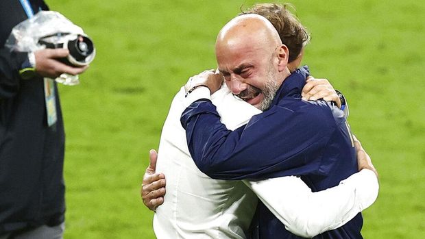 Italy manager Roberto Mancini, left, and Gianluca Vialli, head of the Italian national team celebrate after victory in the penalty shoot out during the Euro 2020 soccer championship final match between England and Italy at Wembley Stadium in London, Sunday, July 11, 2021. (Christian Charisius/dpa via AP)