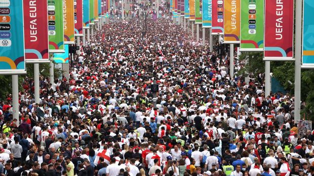 LONDON, ENGLAND - JULY 11: Fans show their support as they make their way down Olympic Way during the UEFA Euro 2020 Championship Final between Italy and England at Wembley Stadium on July 11, 2021 in London, England. (Photo by Alex Pantling/Getty Images)