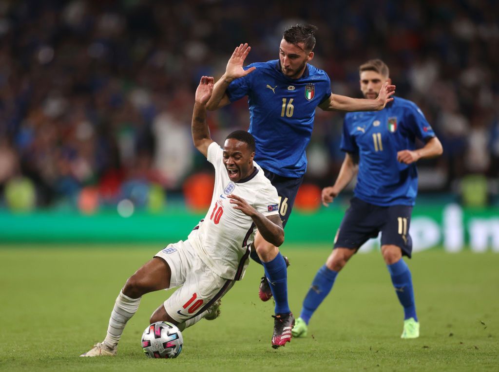 LONDON, ENGLAND - JULY 11: Raheem Sterling of England is challenged by Bryan Cristante of Italy during the UEFA Euro 2020 Championship Final between Italy and England at Wembley Stadium on July 11, 2021 in London, England. (Photo by Carl Recine - Pool/Getty Images)