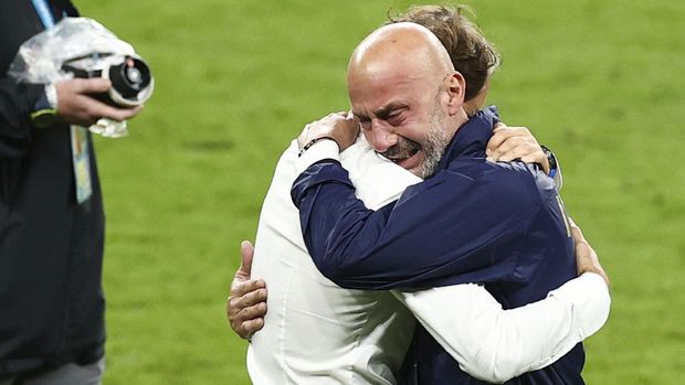 Italy manager Roberto Mancini, left, and Italy national team head Gianluca Vialli celebrate after their penalty shootout win during the Euro 2020 soccer championship final match between England and Italy at Wembley Stadium, London, Sunday 11 July 2021. (Christian Charisius/dpa via AP)