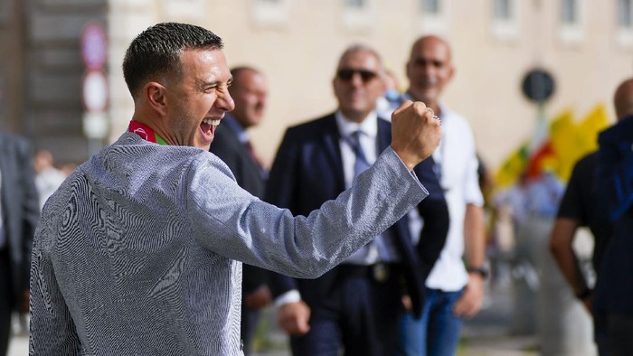 Italys Federico Bernardeschi reacts as he leaves the Quirinale Presidential Palace where he attended with his team a ceremony host by President Sergio Mattarella in Rome, Monday, July 12, 2021, to celebrate their victory of the Euro 2020 soccer championships in a final played at Wembley stadium in London on Sunday. Italy beat England 3-2 in a penalty shootout after a 1-1 draw. (AP Photo/Alessandra Tarantino)