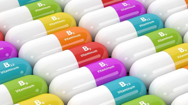 3d rendering of group B vitamin pills in rows