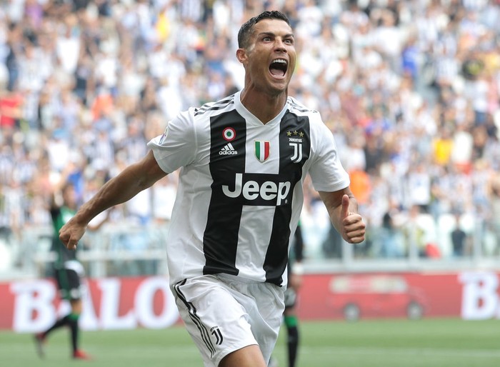Cristiano Ronaldo TURIN, ITALY - SEPTEMBER 16: Cristiano Ronaldo of Juventus FC celebrates after scoring the opening goal during the serie A match between Juventus and US Sassuolo at Allianz Stadium on September 16, 2018 in Turin, Italy. (Photo by Emilio Andreoli/Getty Images)