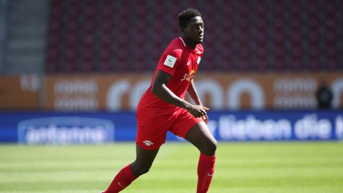 AUGSBURG, GERMANY - JUNE 27: Ibrahima Konate of Leipzig runs with the ball during the Bundesliga match between FC Augsburg and RB Leipzig at WWK-Arena on June 27, 2020 in Augsburg, Germany. (Photo by Alexander Hassenstein/Getty Images)