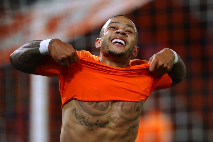 ROTTERDAM, NETHERLANDS - OCTOBER 10:  Memphis Depay of Netherlands celebrates scoring his teams third goal of the game during the UEFA Euro 2020 qualifier between Netherlands and Northern Ireland on October 10, 2019 in Rotterdam, Netherlands. (Photo by Dean Mouhtaropoulos/Getty Images,)