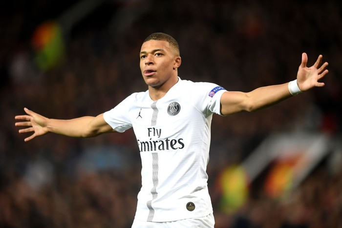 Kylian Mbappe MANCHESTER, ENGLAND - FEBRUARY 12: Kylian Mbappe of PSG celebrates after scoring his sides second goal during the UEFA Champions League Round of 16 First Leg match between Manchester United and Paris Saint-Germain at Old Trafford on February 12, 2019 in Manchester, England. (Photo by Michael Regan/Getty Images)
