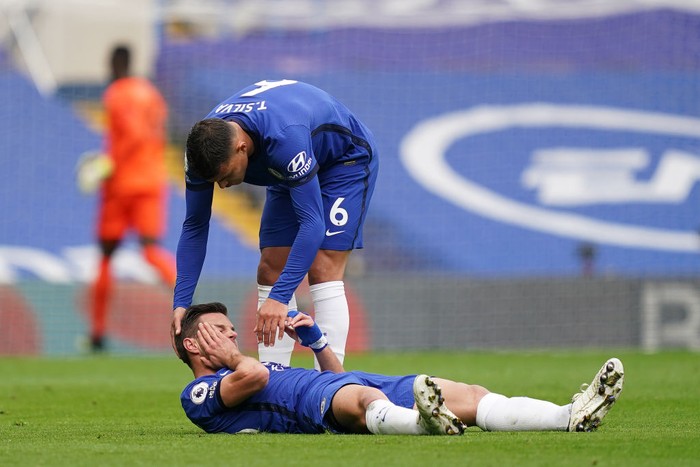 LONDON, ENGLAND - APRIL 03: Thiago Silva of Chelsea checks on teammate Cesar Azpilicueta as he reacts with an injury during the Premier League match between Chelsea and West Bromwich Albion at Stamford Bridge on April 03, 2021 in London, England. Sporting stadiums around the UK remain under strict restrictions due to the Coronavirus Pandemic as Government social distancing laws prohibit fans inside venues resulting in games being played behind closed doors. (Photo by John Walton - Pool/Getty Images)