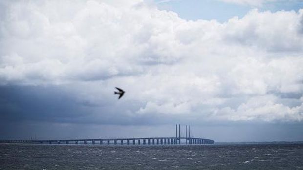 A picture taken on June 30, 2020 in Copenhagen, shows a view of the Oresund Bridge, which connects Denmark and Sweden (Copenhagen and Malm). - The 20th anniversary of the bridge will be marked on July 1, 2020. (Photo by Niels Christian Vilmann / Ritzau Scanpix / AFP) / Denmark OUT