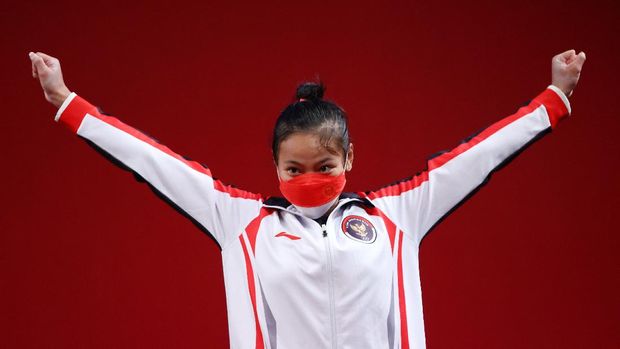 Tokyo 2020 Olympics - Weightlifting - Women's 49kg - Medal Ceremony - Tokyo International Forum, Tokyo, Japan - July 24, 2021. Bronze medalist Windy Cantika Aisah of Indonesia reacts. REUTERS/Edgard Garrido