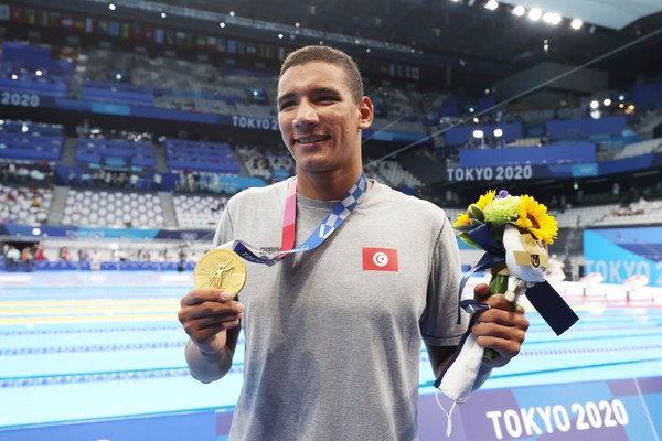 TOKYO, JAPAN - JULY 25: Ahmed Hafnaoui of Team Tunisia poses with the gold medal for the Mens 400m Freestyle Final on day two of the Tokyo 2020 Olympic Games at Tokyo Aquatics Centre on July 25, 2021 in Tokyo, Japan. (Photo by Al Bello/Getty Images)