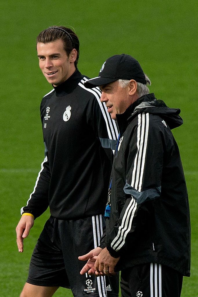 SEVILLE, SPAIN - MAY 02:  Head coach Carlo Ancelott of Real Madrid celebrates with Gareth Bale after Cristiano Ronaldo scored his team's 3rd goal during the La Liga match between Sevilla FC and Real Madrid CF at Estadio Ramon Sanchez Pizjuan on May 2, 2015 in Seville, Spain.  (Photo by Denis Doyle/Getty Images)