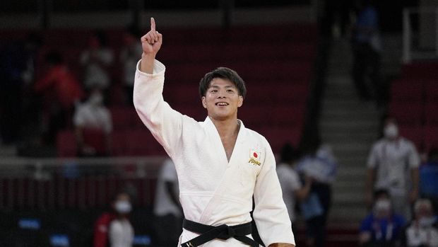 Hifumi Abe of Japan reacts after competing against Vazha Margvelashvili of Georgia in their men's -66kg gold medal judo match at the 2020 Summer Olympics, Sunday, July 25, 2021, in Tokyo, Japan. (AP Photo/Vincent Thian)