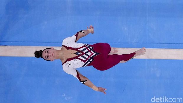 Pauline Schaefer-Betz, of Germany, performs on the beam during women's artistic gymnastic qualifications at the 2020 Summer Olympics, Sunday, July 25, 2021, in Tokyo. (AP Photo/Morry Gash)