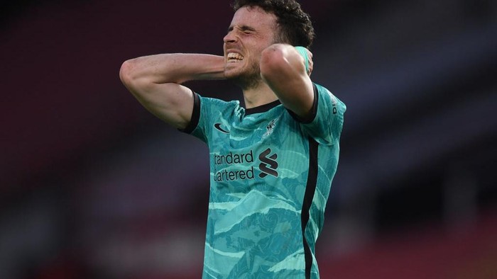 MANCHESTER, ENGLAND - MAY 13: Diogo Jota of Liverpool reacts during the Premier League match between Manchester United and Liverpool at Old Trafford on May 13, 2021 in Manchester, England. Sporting stadiums around the UK remain under strict restrictions due to the Coronavirus Pandemic as Government social distancing laws prohibit fans inside venues resulting in games being played behind closed doors. (Photo by Michael Regan/Getty Images)