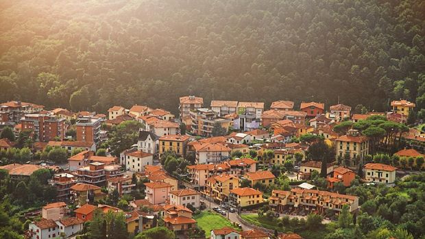 Montecatini Terme di Italia Street with houses and cars in a forest mountainous area town Montecatini Terme in Tuscany in summer Italy, Europe