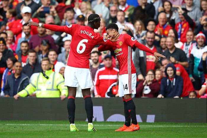 MANCHESTER, ENGLAND - SEPTEMBER 24: Paul Pogba of Manchester United (L) celebrates scoring his sides fourth goal with Jesse Lingard of Manchester United (R) during the Premier League match between Manchester United and Leicester City at Old Trafford on September 24, 2016 in Manchester, England.  (Photo by Clive Brunskill/Getty Images)