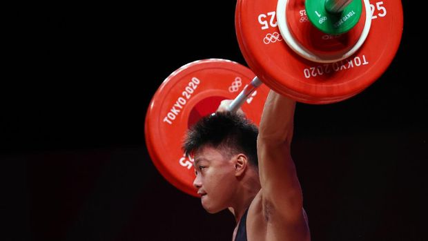 Tokyo 2020 Olympics - Weightlifting - Men's 73kg - Group B - Tokyo International Forum, Tokyo, Japan - July 28, 2021. Rahmat Abdullah of Indonesia in action. REUTERS/Edgard Garrido