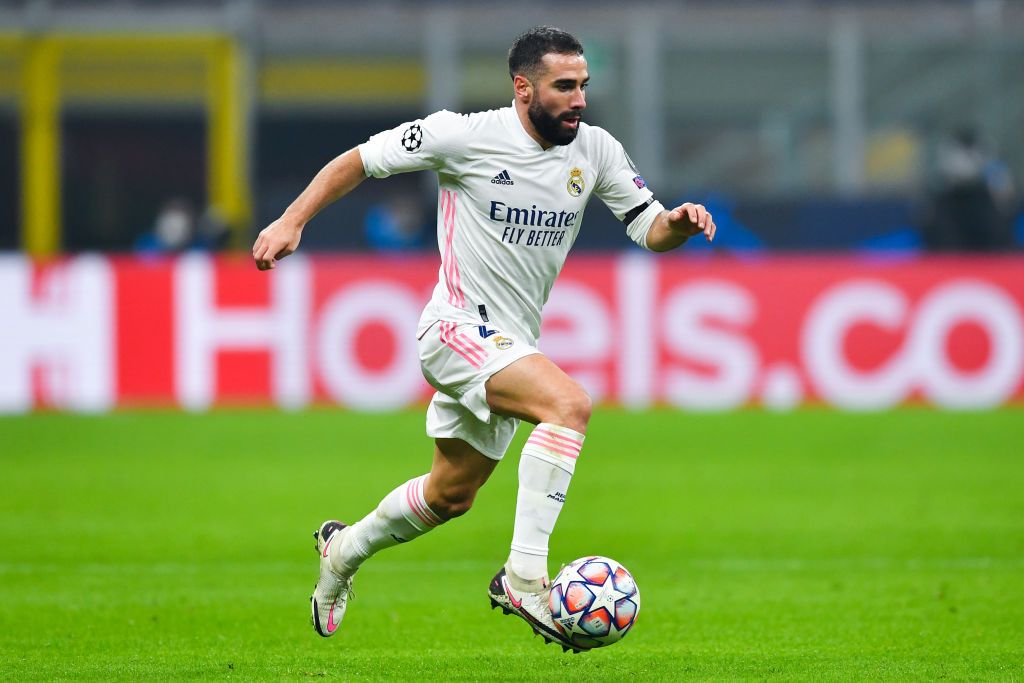 MILAN, ITALY - NOVEMBER 25: Daniel Carvajal of Real Madrid runs with the ball during the UEFA Champions League Group B stage match between FC Internazionale and Real Madrid at Stadio Giuseppe Meazza on November 25, 2020 in Milan, Italy. Football Stadiums around Europe remain empty due to the Coronavirus Pandemic as Government social distancing laws prohibit fans inside venues resulting in fixtures being played behind closed doors. (Photo by Valerio Pennicino/Getty Images)