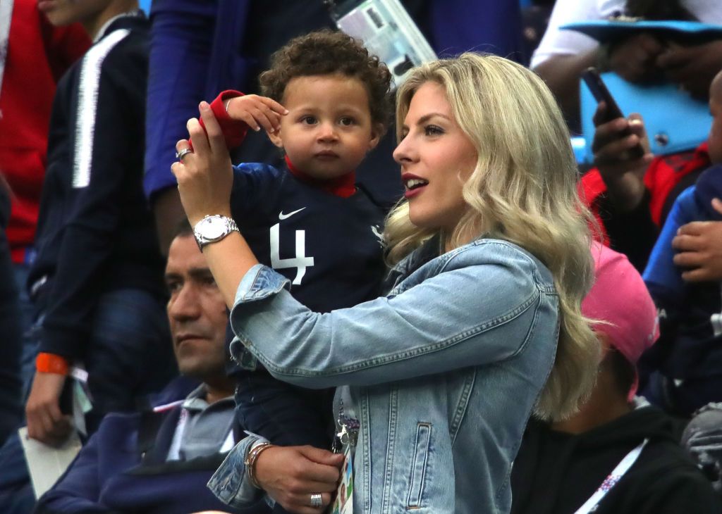 SAINT PETERSBURG, RUSSIA - JULY 10:  Raphael Varane's wife Camille Tytgat and son Ruben attend the 2018 FIFA World Cup Russia Semi Final match between Belgium and France at Saint Petersburg Stadium on July 10, 2018 in Saint Petersburg, Russia.  (Photo by Alexander Hassenstein/Getty Images)