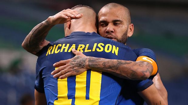 Tokyo 2020 Olympics - Soccer Football - Men - Group D - Saudi Arabia v Brazil - Saitama Stadium, Saitama, Japan - July 28, 2021. Dani Alves of Brazil celebrates with Richarlison of Brazil after the match REUTERS/Molly Darlington