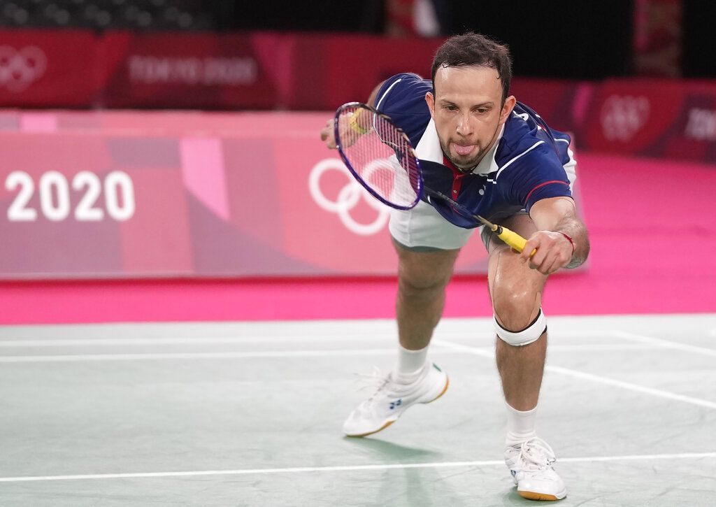 Indonesia's Anthony Sinisuka Ginting competes against Guatemala's Kevin Cordon during their men's singles bronze medal Badminton match at the 2020 Summer Olympics, Monday, Aug. 2, 2021, in Tokyo, Japan. (AP Photo/Dita Alangkara)