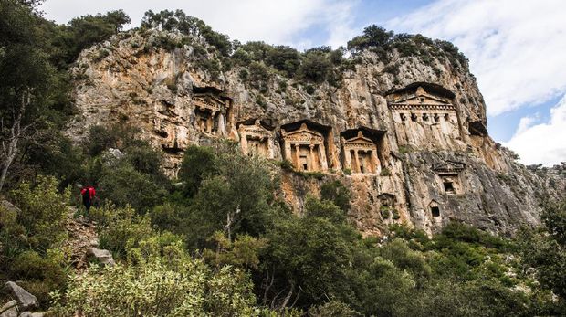 Lykian temple tombs cut out of the rock face above the Dalyan river at the ancient city of Kaunos in southern Turkey.