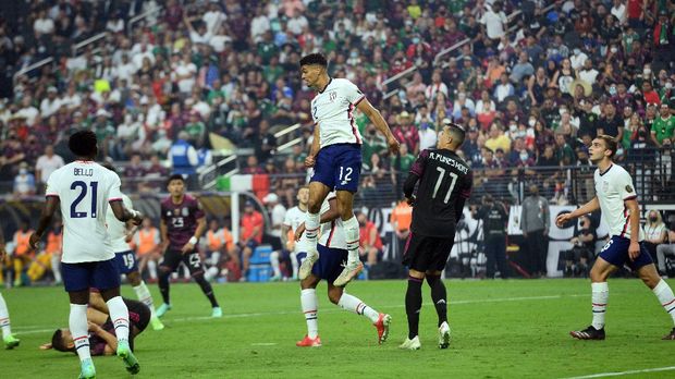 Aug 1, 2021; Las Vegas, Nevada, USA; the United States defender Miles Robinson (12) heads the ball against the Mexico during the first half of the CONCACAF Gold Cup final soccer match at Allegiant Stadium. Mandatory Credit: Joe Camporeale-USA TODAY Sports