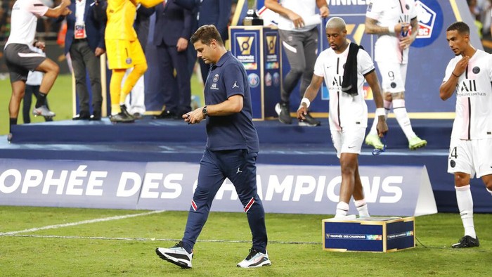 PSGs head coach Mauricio Pochettino walks after loosing the French Super Cup final soccer match between Lille and Paris Saint-Germain at Bloomfield Stadium in Tel Aviv, Israel, Sunday, Aug. 1, 2021. (AP Photo/Ariel Schalit)