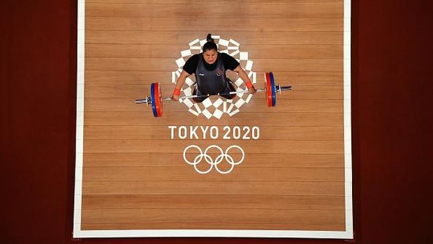 TOKYO, JAPAN - AUGUST 02: Nurul Akmal of Team Indonesia competes during the Weightlifting - Women's 87kg+ Group A on day ten of the Tokyo 2020 Olympic Games at Tokyo International Forum on August 02, 2021 in Tokyo, Japan. (Photo by Chris Graythen/Getty Images)