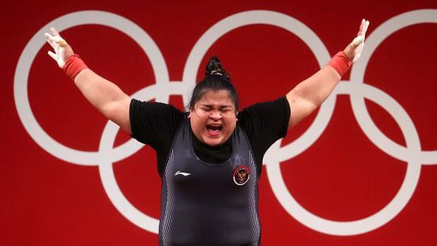 TOKYO, JAPAN - AUGUST 02: Nurul Akmal of Team Indonesia competes during the Weightlifting - Women's 87kg+ Group A on day ten of the Tokyo 2020 Olympic Games at Tokyo International Forum on August 02, 2021 in Tokyo, Japan. (Photo by Chris Graythen/Getty Images)