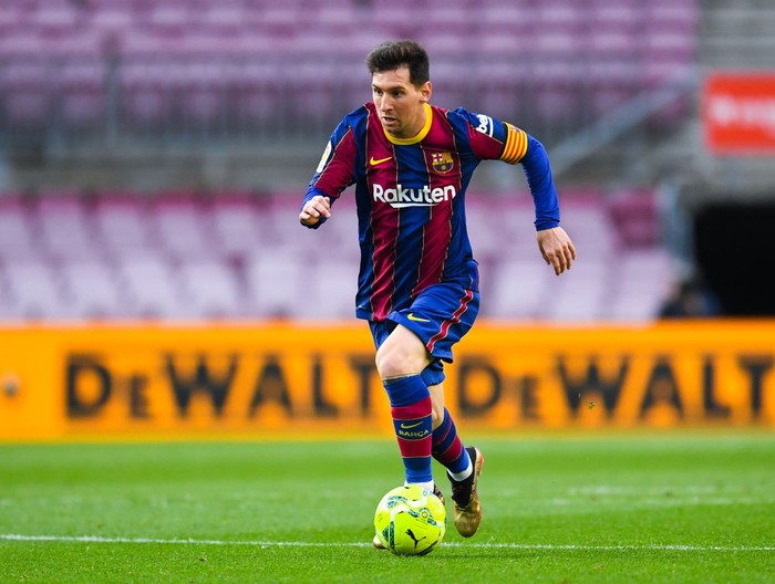 Lionel Messi BARCELONA, SPAIN - MAY 16: Lionel Messi of FC Barcelona runs with the ball during the La Liga Santander match between FC Barcelona and RC Celta at Camp Nou on May 16, 2021 in Barcelona, Spain. Sporting stadiums around Spain remain under strict restrictions due to the Coronavirus Pandemic as Government social distancing laws prohibit fans inside venues resulting in games being played behind closed doors. (Photo by David Ramos/Getty Images)