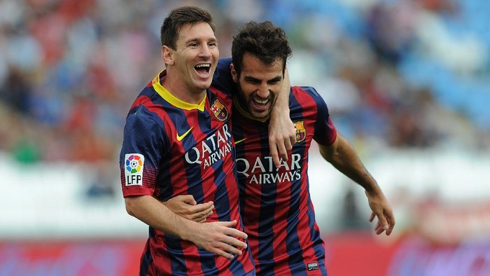 ALMERIA, SPAIN - SEPTEMBER 28:  Lionel Messi (L) celebrates with Cesc Fabregas after scoring FC Barcelonas opening goal during the La Liga match between UD Almeria and FC Barcelona on September 28, 2013 in Almeria, Spain.  (Photo by Denis Doyle/Getty Images)