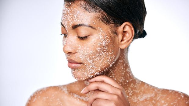 Studio shot of a beautiful young woman using sea salt in her beauty routine