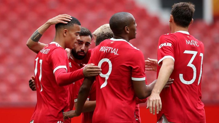 MANCHESTER, ENGLAND - AUGUST 07: Mason Greenwood of Manchester United celebrates scoring his teams first goal during the pre-season friendly match between Manchester United and Everton at Old Trafford on August 07, 2021 in Manchester, England. (Photo by Jan Kruger/Getty Images)