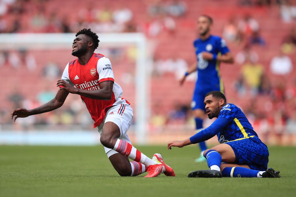 LONDON, ENGLAND - AUGUST 01: Thomas Partey of Arsenal reacts before leaving the game injured during the Pre Season Friendly between Arsenal and Chelsea at Emirates Stadium on August 1, 2021 in London, England. (Photo by Marc Atkins/Getty Images)