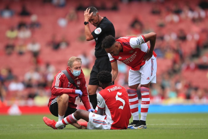 LONDON, ENGLAND - AUGUST 01: Thomas Partey of Arsenal reacts before leaving the game injured during the Pre Season Friendly between Arsenal and Chelsea at Emirates Stadium on August 1, 2021 in London, England. (Photo by Marc Atkins/Getty Images)