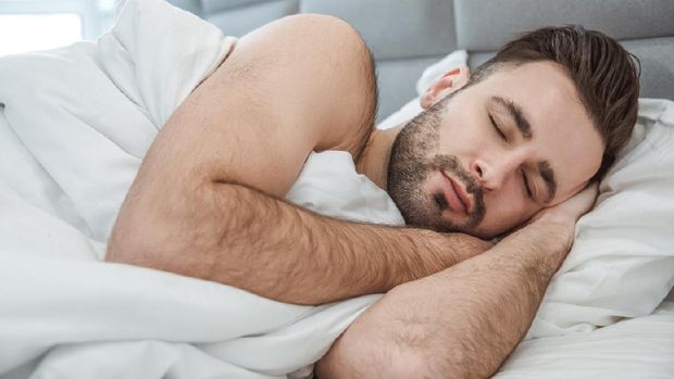 Bachelor middle-aged man daily routine lying on bed sleeping peaceful close-up