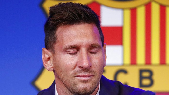 Lionel Messi pauses during a press conference at the Camp Nou stadium in Barcelona, Spain, Sunday, Aug. 8, 2021. FC Barcelona had previously announced the negotiations with Lionel Messi had ended and that Messi would be leaving the club. (AP Photo/Joan Monfort)