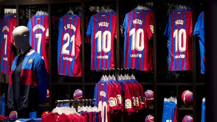 Lionel Messi soccer shirts on sale at Barcelonas merchandise store at the Camp Nou stadium in Barcelona, Spain, Thursday, Aug. 5, 2021. Barcelona announced Thursday that Messi will not stay with the club, saying that the Spanish leagues financial regulations made it impossible to sign the Argentina star to a new contract. (AP Photo/Joan Monfort)