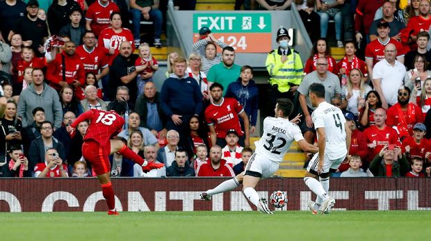 Soccer Football - Pre Season Friendly - Liverpool v Osasuna - Anfield, Liverpool, Britain - August 9, 2021 Liverpool's Takumi Minamino scores their first goal Action Images via Reuters/Craig Brough