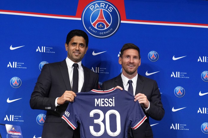 Lionel Messi Lionel Messi, right, poses with his jersey with PSG president Nasser Al-Al-Khelaifi during a press conference Wednesday, Aug. 11, 2021 at the Parc des Princes stadium in Paris. Lionel Messi said he's been enjoying his time in Paris