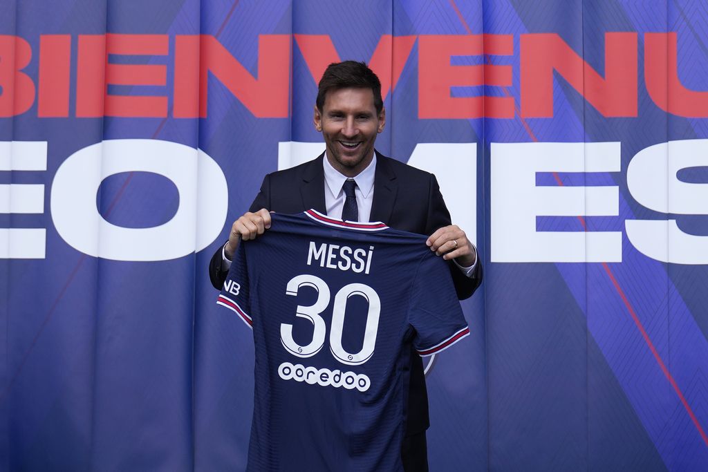 Lionel Messi holds his jersey after a press conference Wednesday, Aug. 11, 2021 at the Parc des Princes stadium in Paris. Lionel Messi said he's been enjoying his time in Paris 