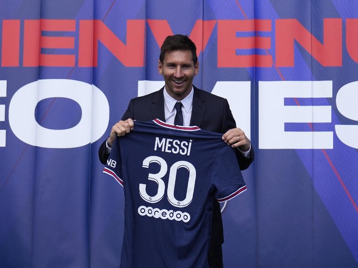 Lionel Messi holds his jersey after a press conference Wednesday, Aug. 11, 2021 at the Parc des Princes stadium in Paris. Lionel Messi said hes been enjoying his time in Paris 