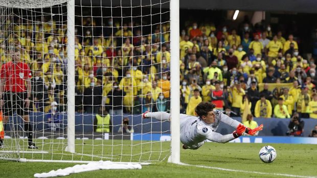 Chelsea's goalkeeper Kepa Arrizabalaga saves the final shot during the penalty shootout of the UEFA Super Cup soccer match between Chelsea and Villarreal at Windsor Park in Belfast, Northern Ireland, Wednesday, Aug. 11, 2021. (AP Photo/Peter Morrison)