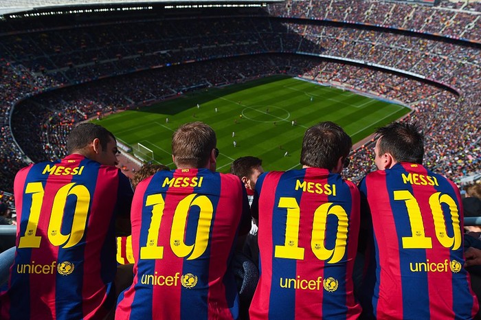 BARCELONA, SPAIN - MARCH 08: FC Barcelona supporters wearing Lionel Messi shirts watch the game from the stands during the La Liga match between FC Barcelona and Rayo Vallecano de Madrid at Camp Nou on March 8, 2015 in Barcelona, Spain.  (Photo by David Ramos/Getty Images)